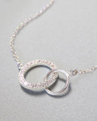 Sterling Silver Cubic Zirconia Infinity Necklace With Interlocking Circles and Pave' Stones