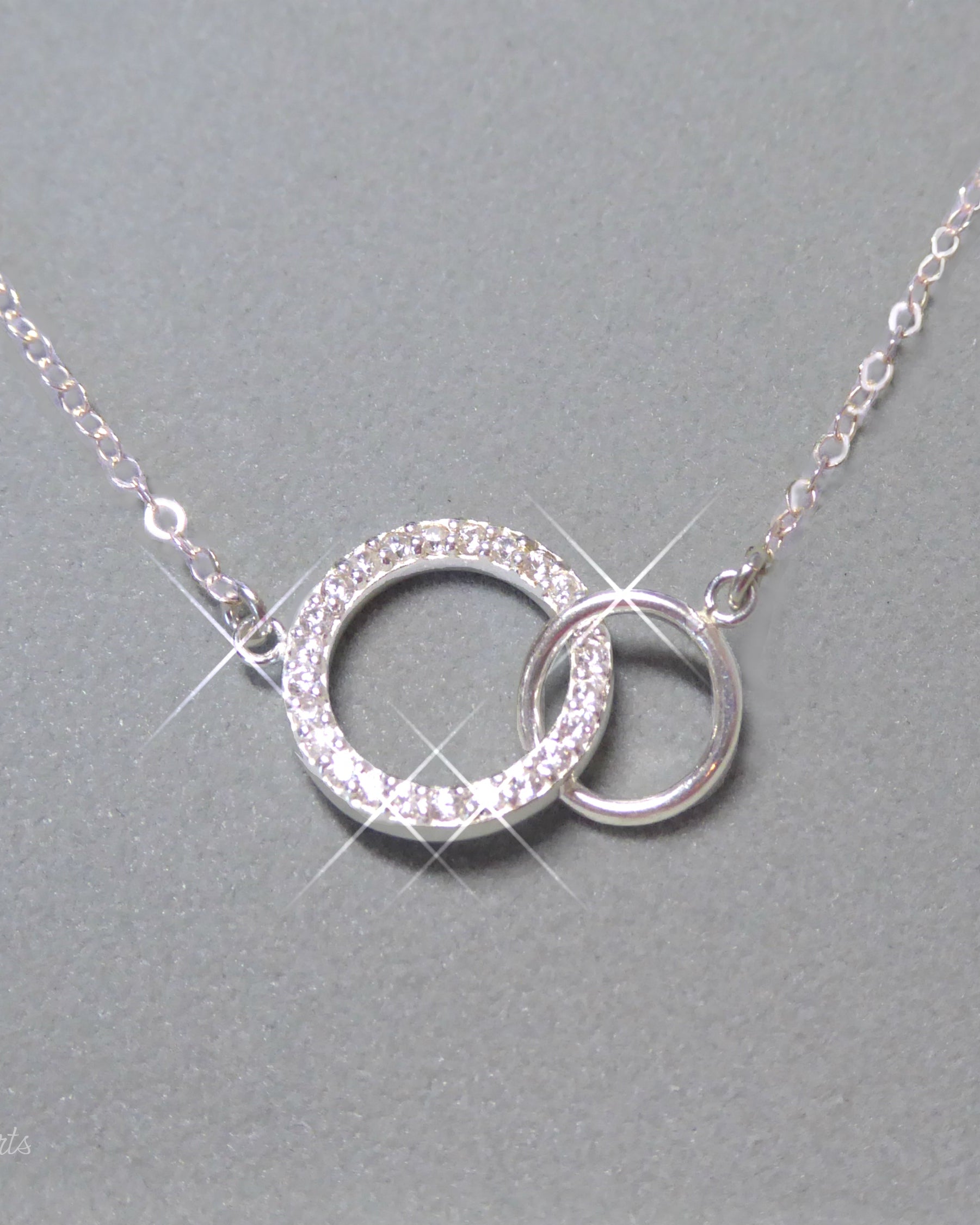 Sterling Silver Cubic Zirconia Infinity Necklace With Interlocking Circles and Pave' Stones